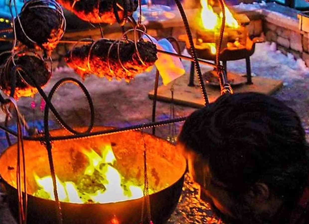 Live-fire grilling at Blue Moon Yurt Event